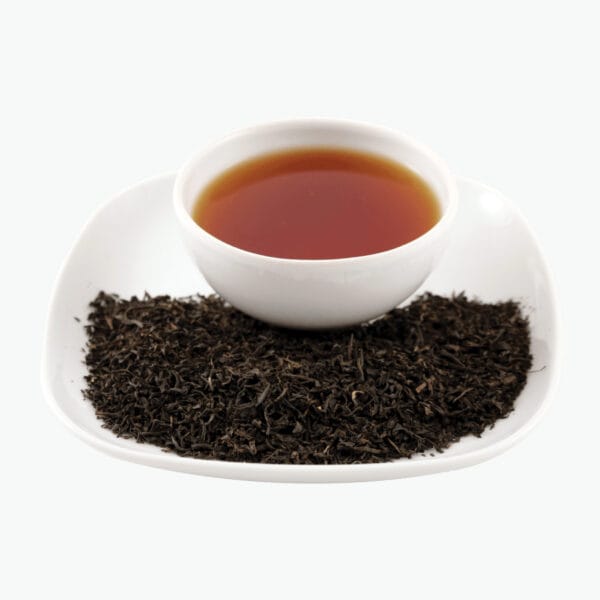 Earl Grey is one of the most recognized flavoudred teas in the world. This quintessentially British tea is typically a black tea base flavoured with oil from the rind of bergamot orange, a citrus fruit with the appearance and flavour somewhere between an orange and a lemon with a little grapefruit and lime thrown in. Queen Elizabeth II is drinking it with milk without sugar.